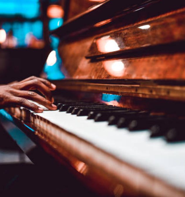 African Male Playing Beautiful Song On Piano